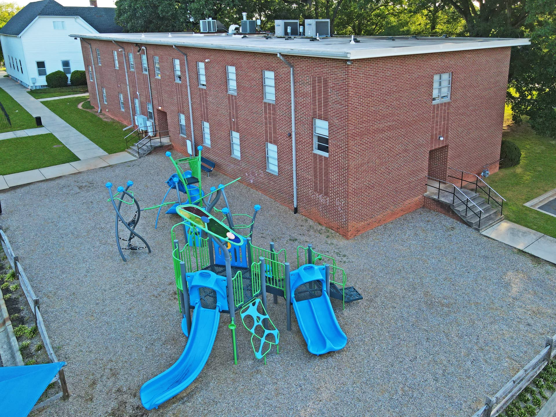 Brick gymnasium and fellowship building with playground