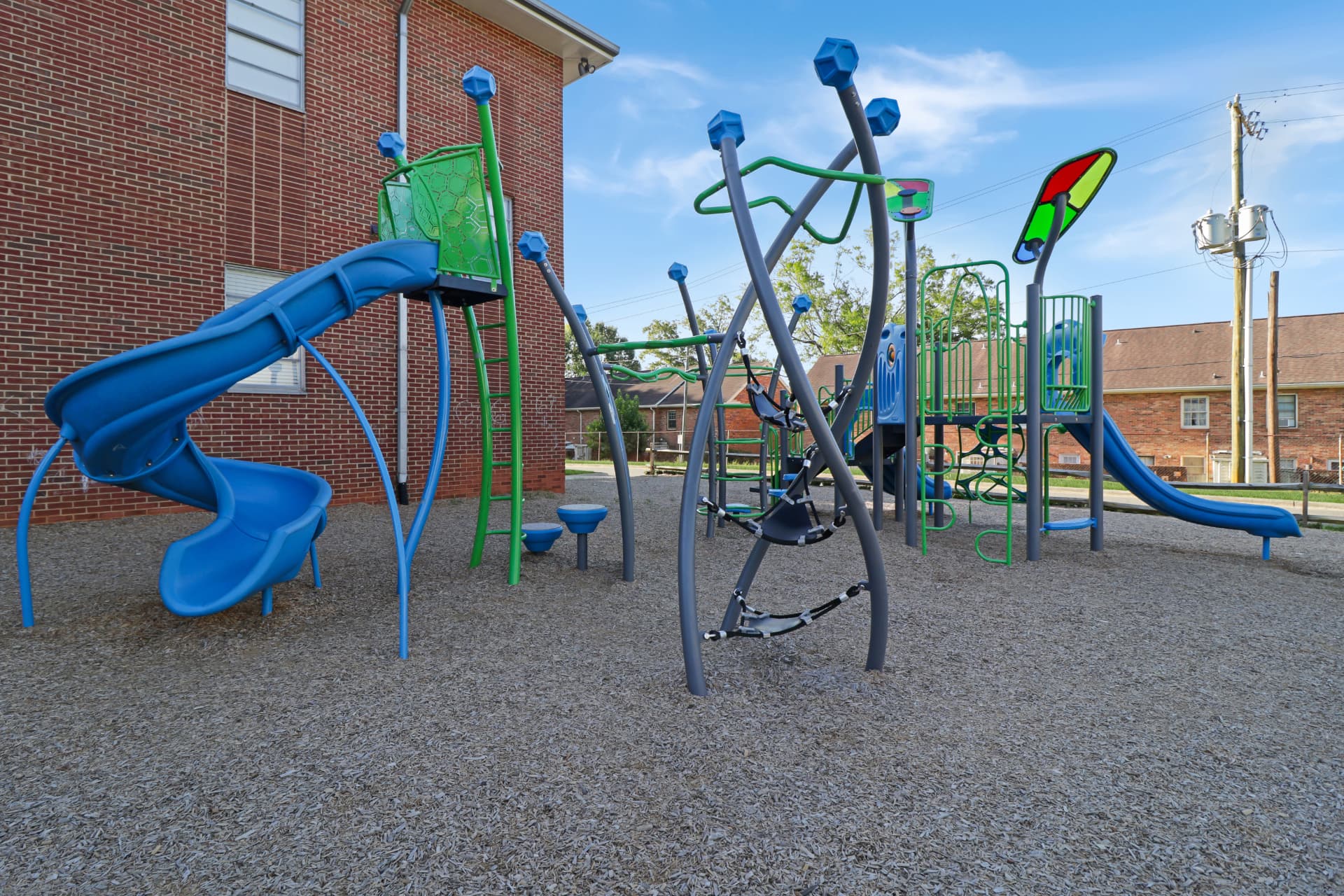 On-site playground beside the brick education building