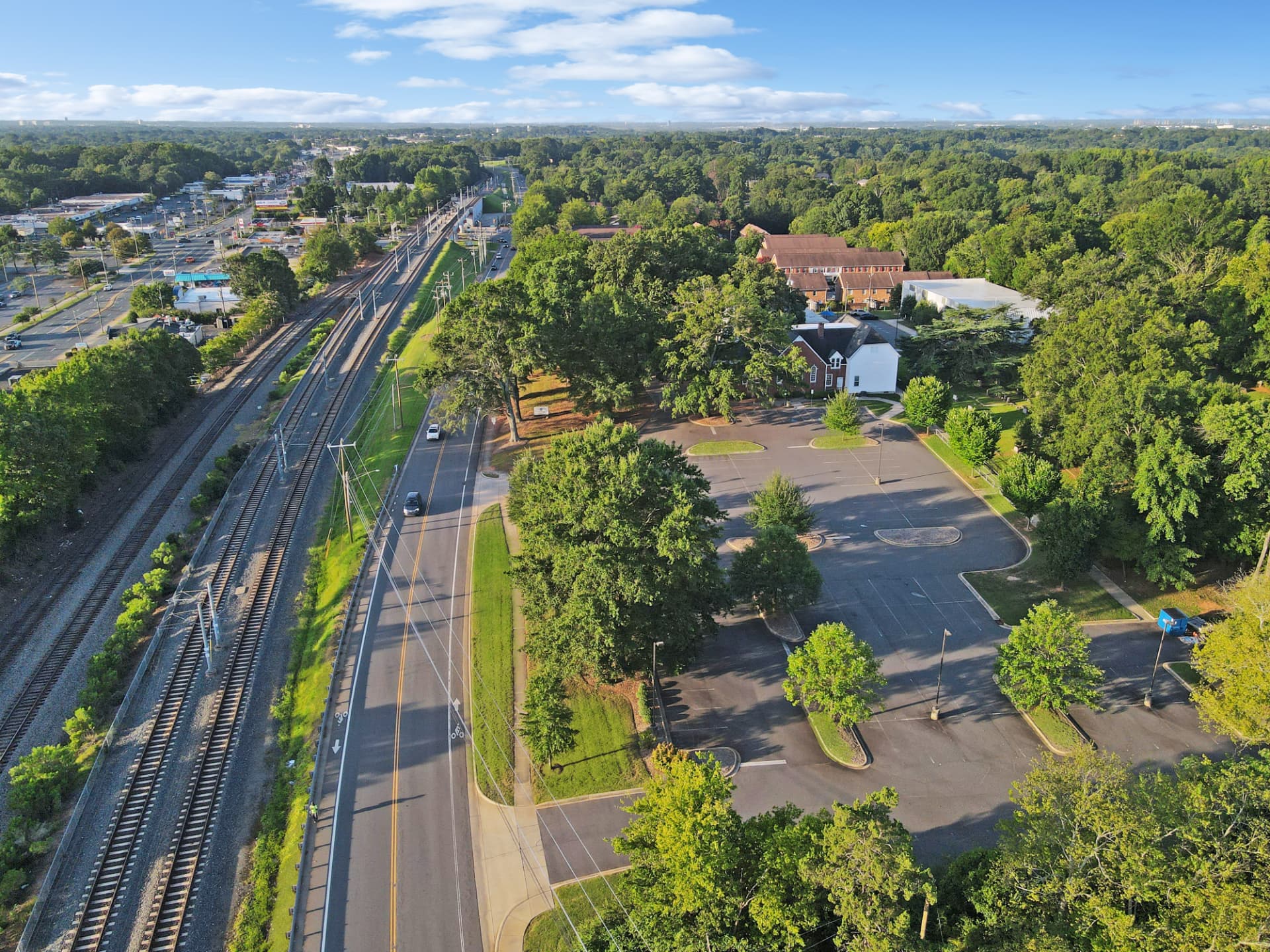 Aerial view of the campus along the Old Pineville Road rail corridor